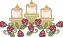 three candles with small roses around them
