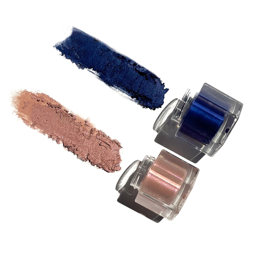 two jars of eyeshadow, a soft pink and a deep blue shade